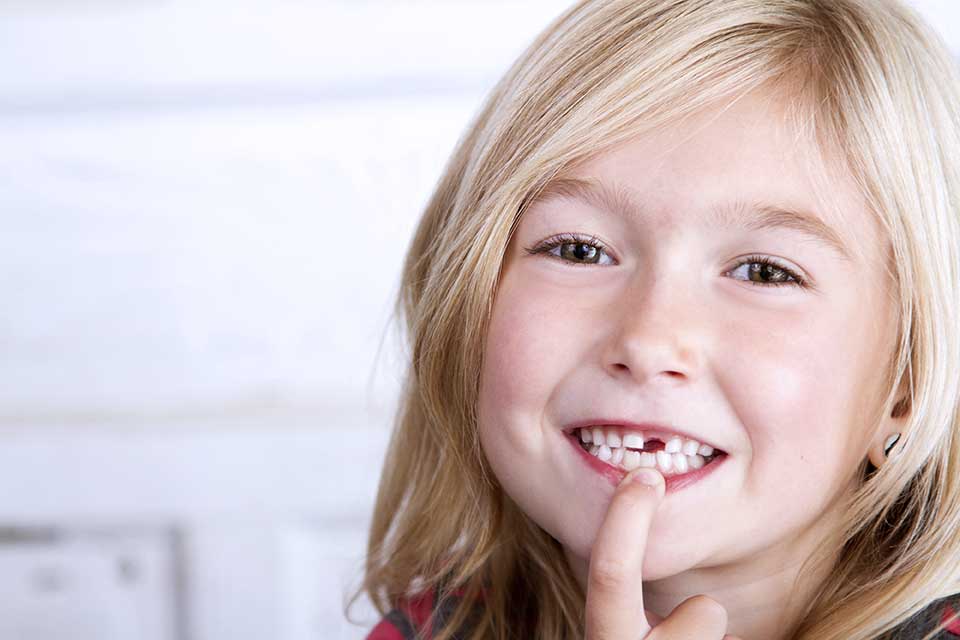 childs adult teeth coming in yellow