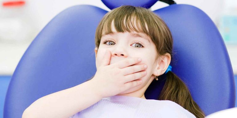 Why are my child’s adult teeth coming in yellow